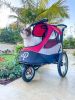 "Trailblazer Pet Jogger With Shock Absorbing Wheels" by Petique Inc.